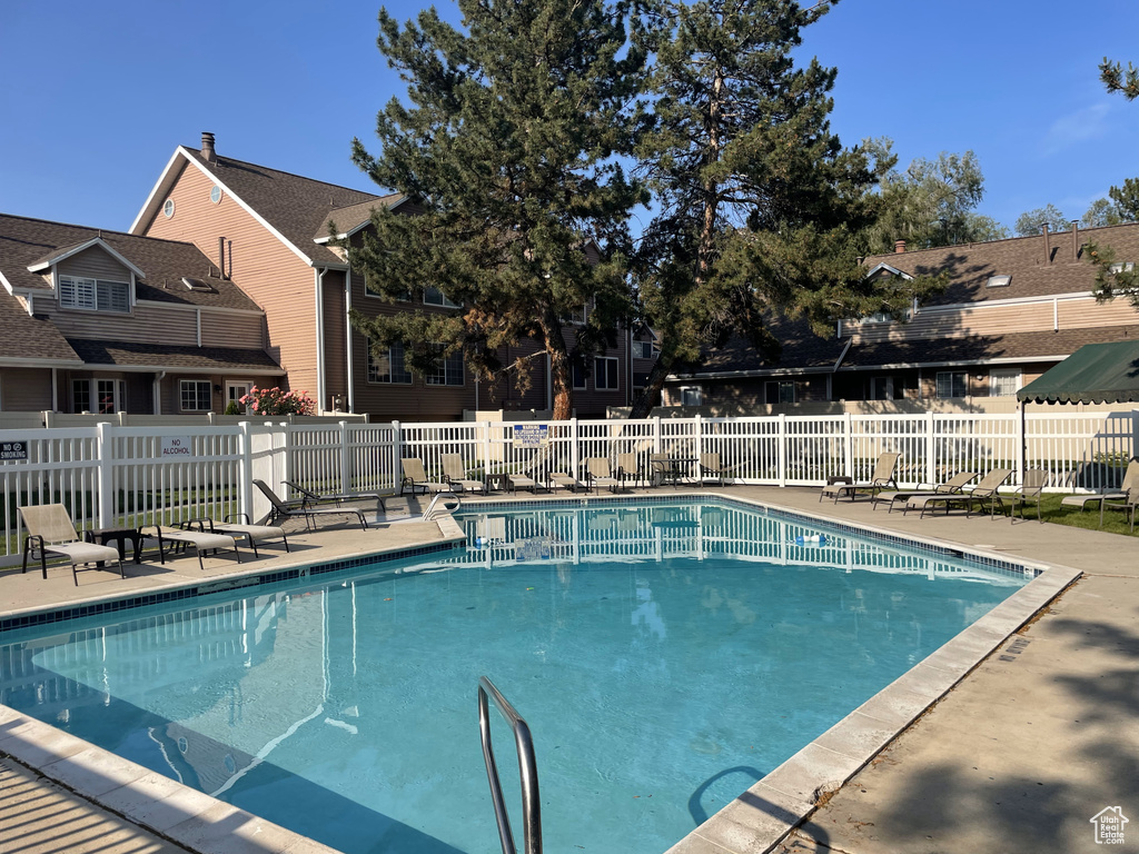 Community pool featuring a patio