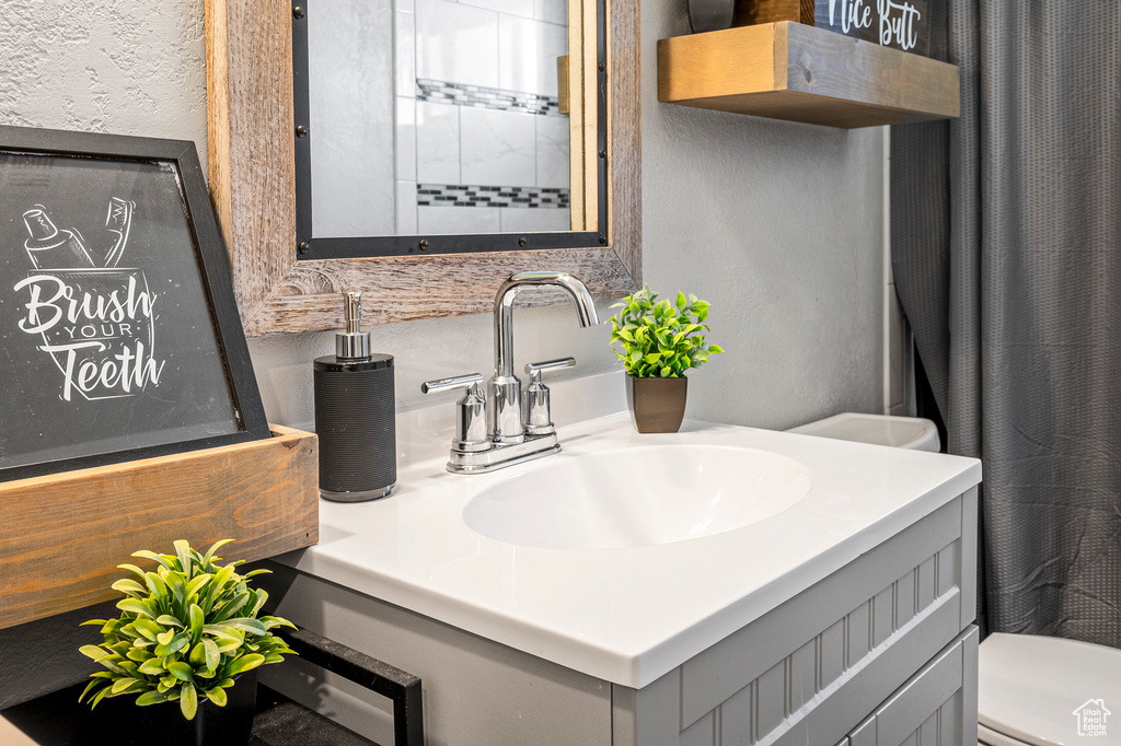 Bathroom with vanity and toilet