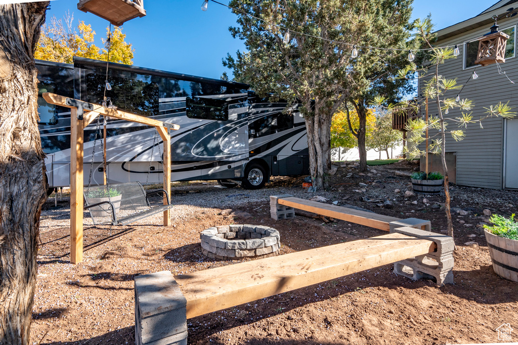 View of yard featuring an outdoor fire pit