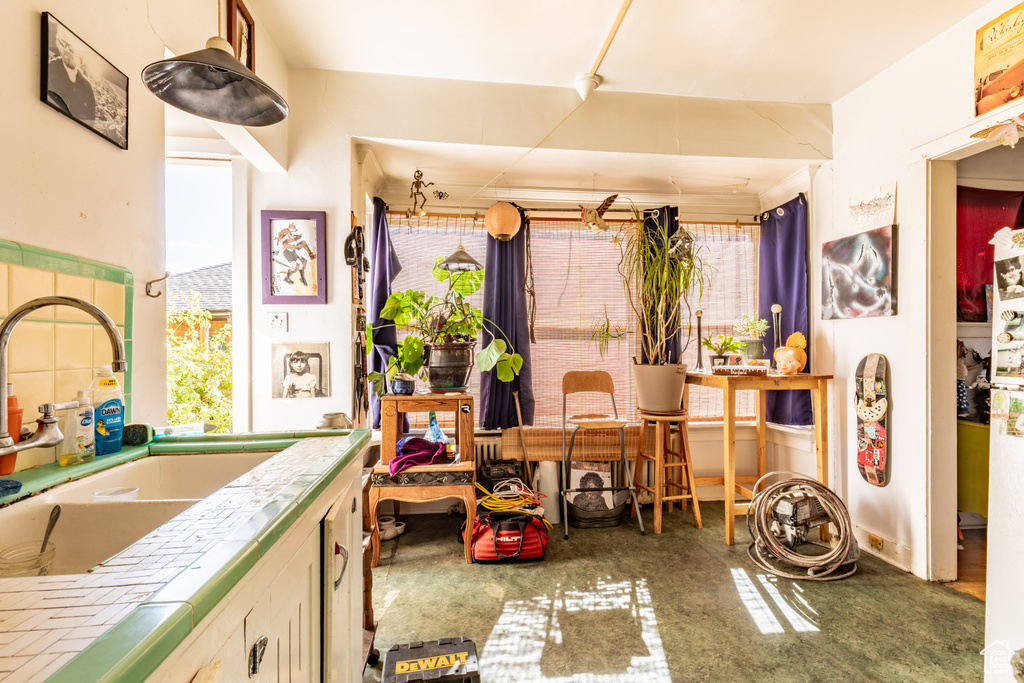 Interior space featuring sink and tile counters