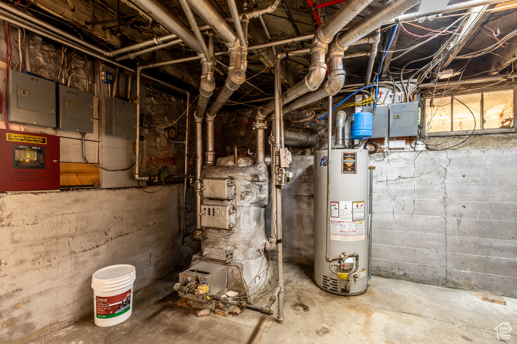 Utilities featuring electric panel and gas water heater