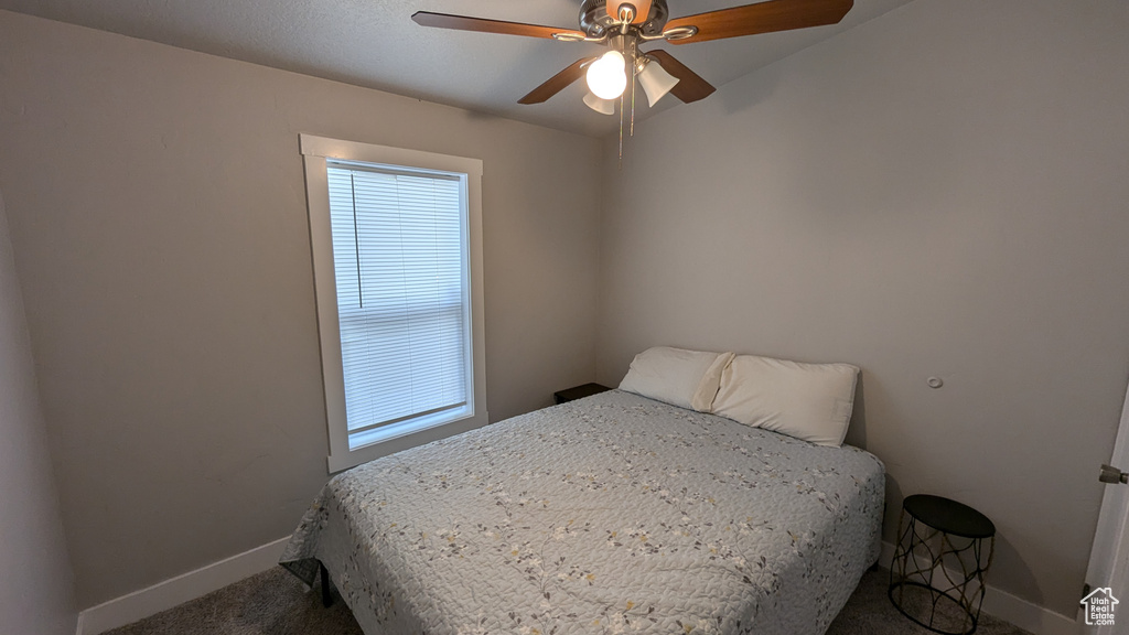 Bedroom featuring carpet flooring and ceiling fan