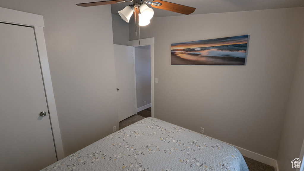 Bedroom with ceiling fan and a closet