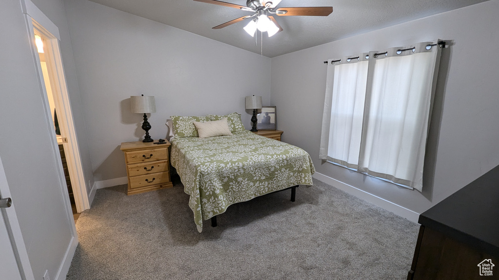 Bedroom with carpet and ceiling fan