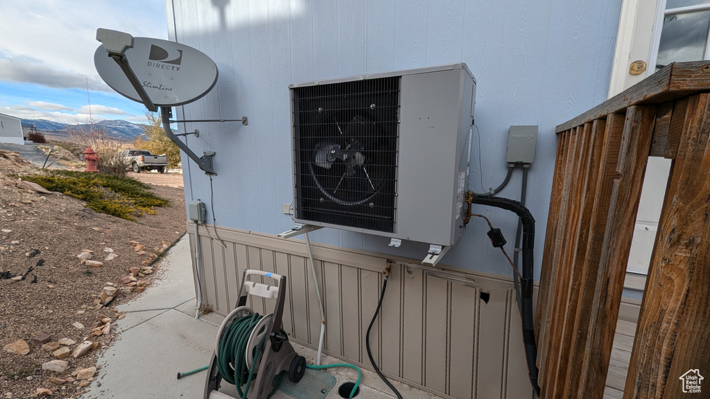 Details featuring a mountain view, ac unit, and concrete floors