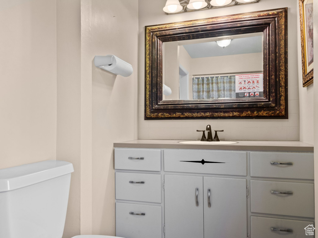 Bathroom featuring vanity and toilet