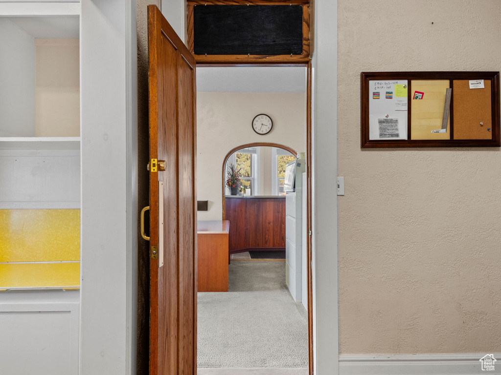 Hallway featuring carpet