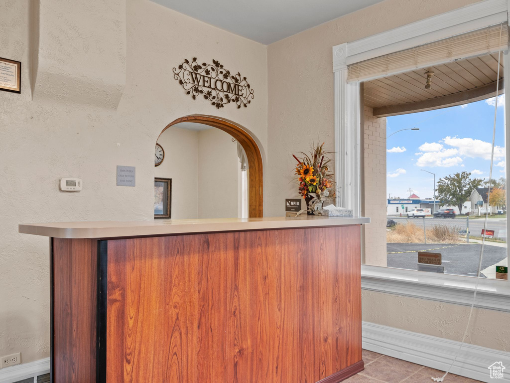 Bar featuring light tile patterned flooring