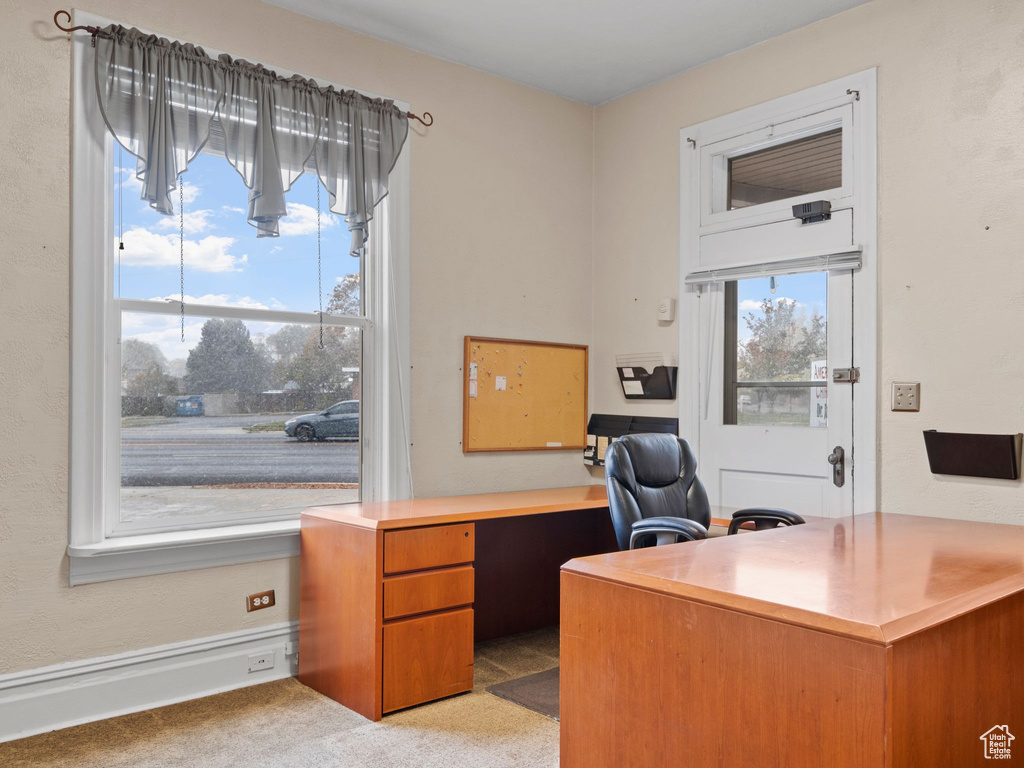 Office with light colored carpet