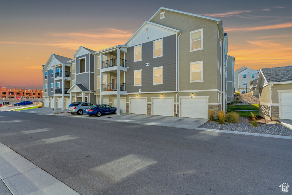 Outdoor building at dusk with a garage