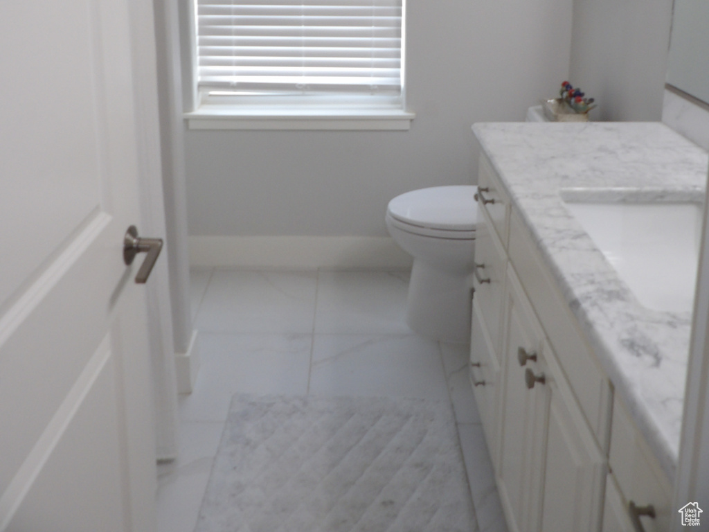 Bathroom with vanity and toilet