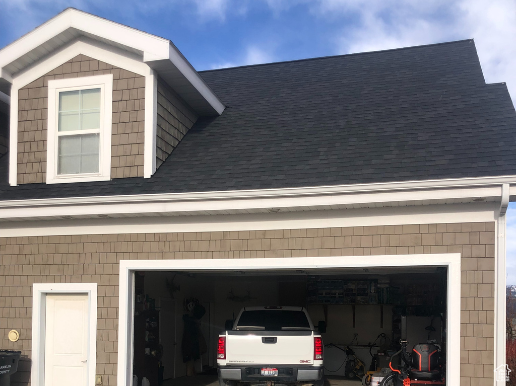 Garage featuring driveway