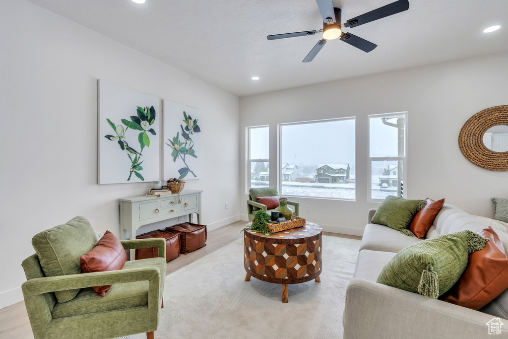 Living room featuring ceiling fan