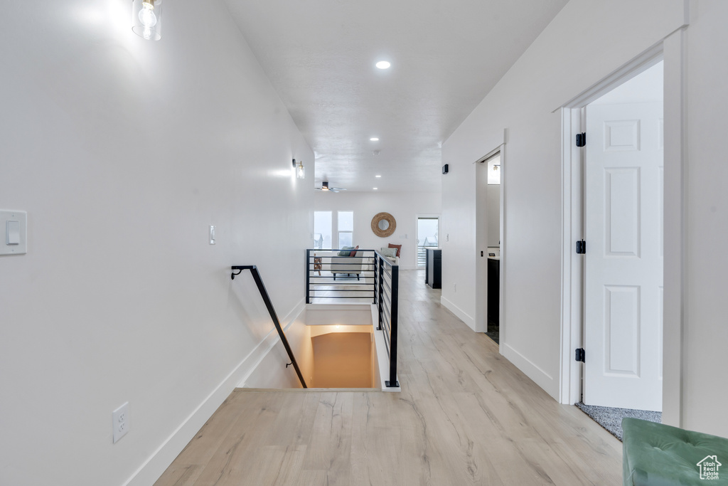 Hall featuring light wood-type flooring