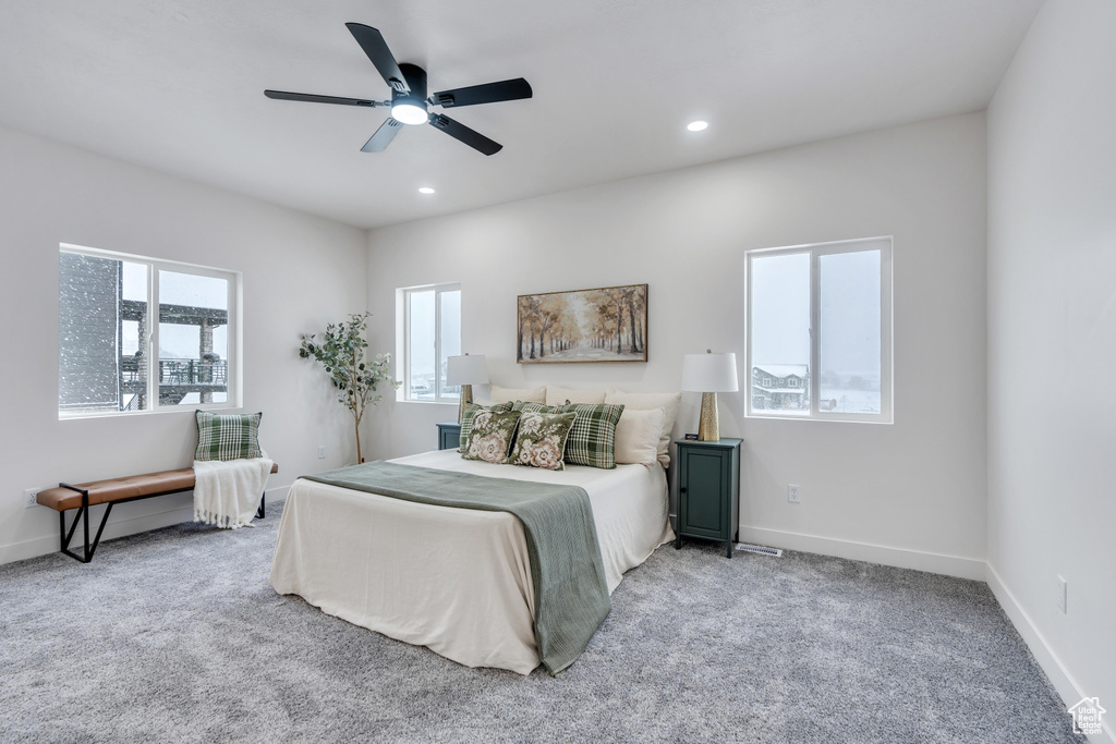 Bedroom with light carpet and ceiling fan