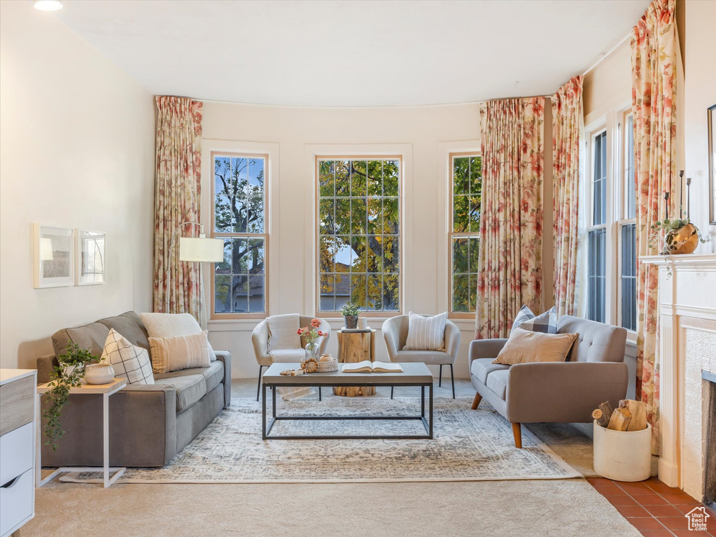 Sunroom / solarium featuring a tiled fireplace