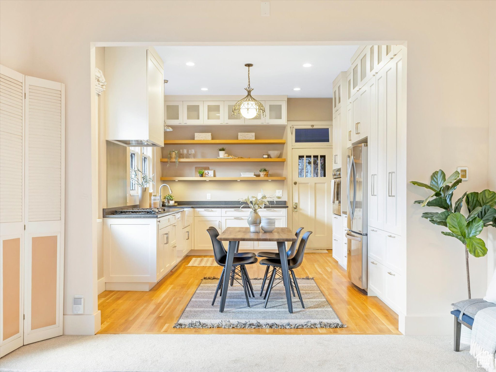 Dining space featuring light hardwood / wood-style flooring