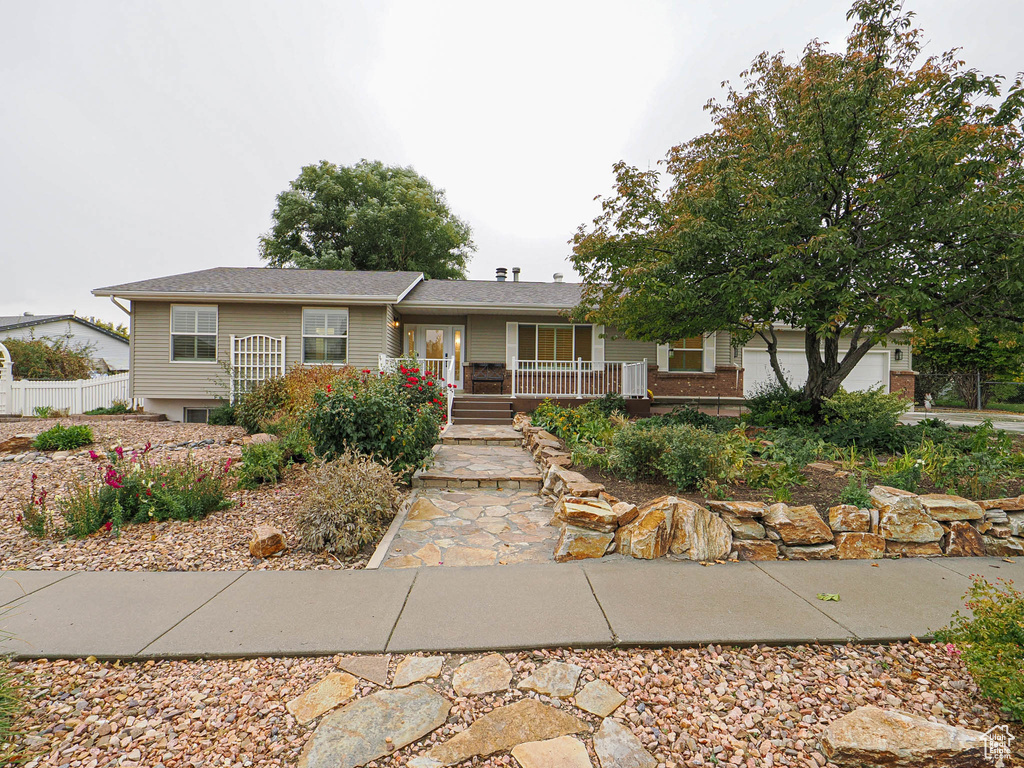 Single story home featuring a porch