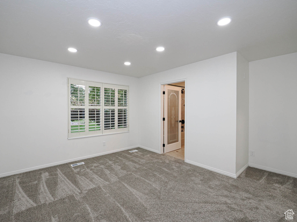 Spare room featuring carpet floors