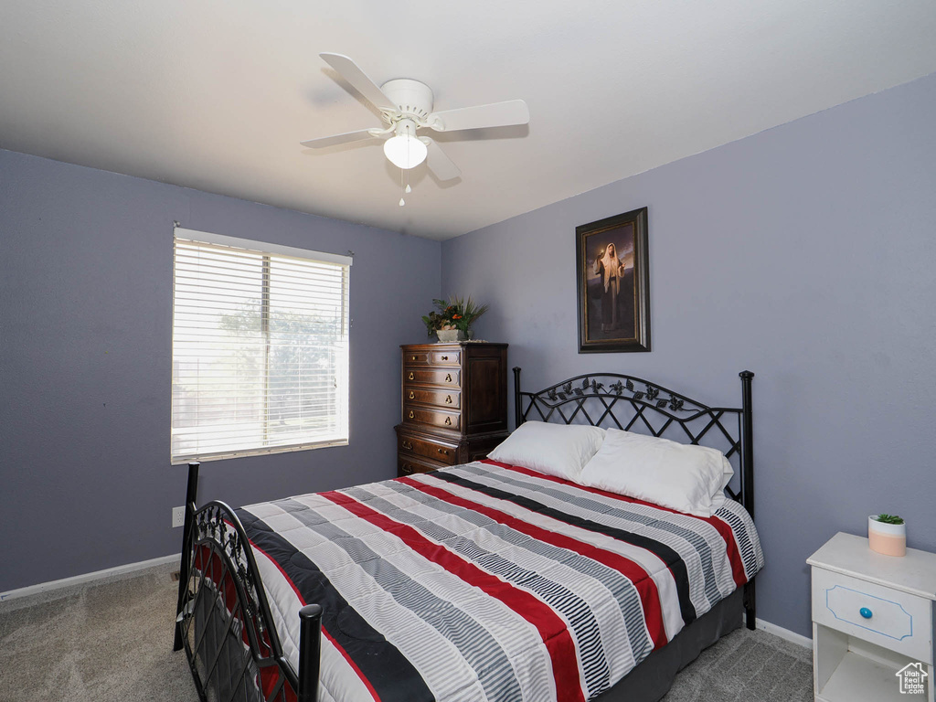 Bedroom featuring carpet and ceiling fan