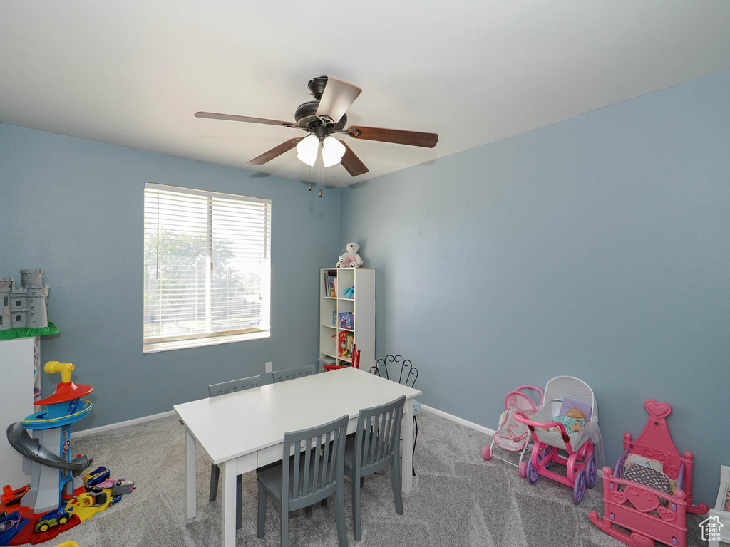 Rec room with ceiling fan and carpet flooring