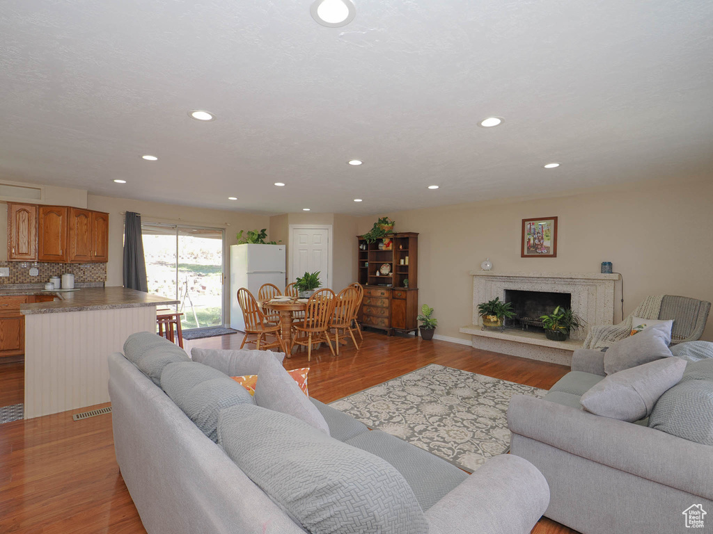 Living room with light hardwood / wood-style flooring