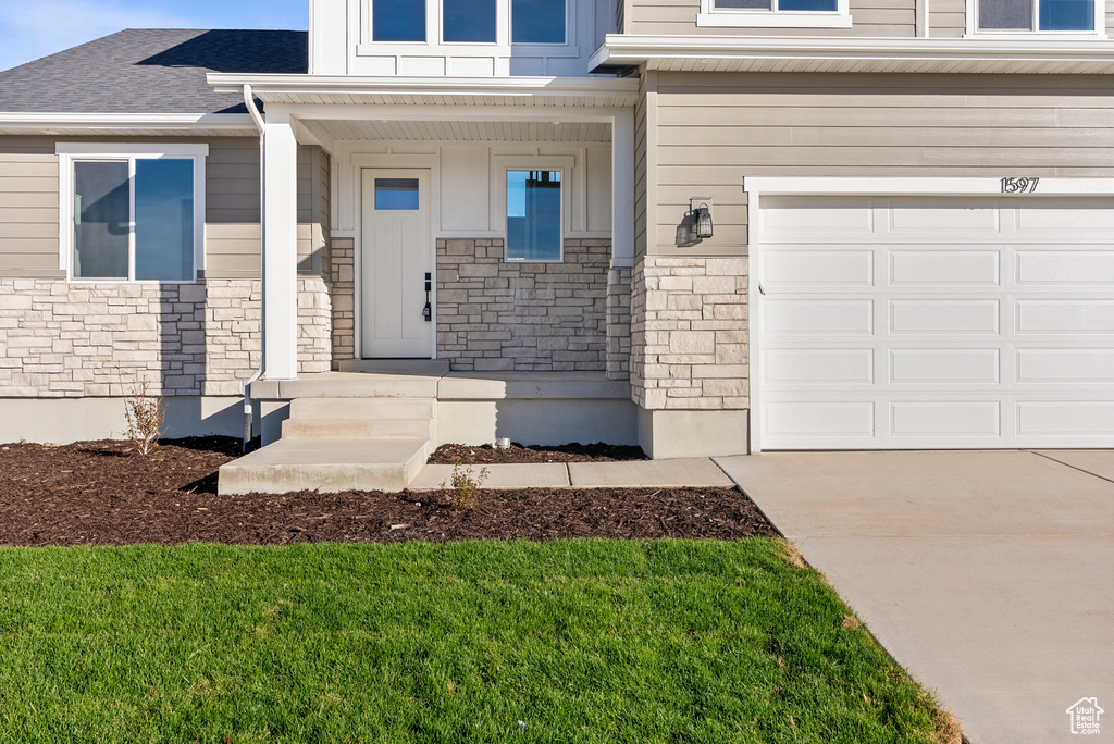 Property entrance with a garage