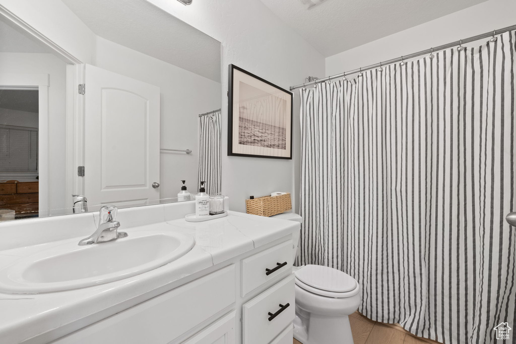 Bathroom featuring vanity and toilet