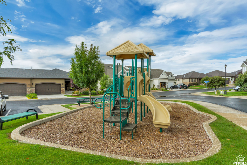 View of play area with a yard