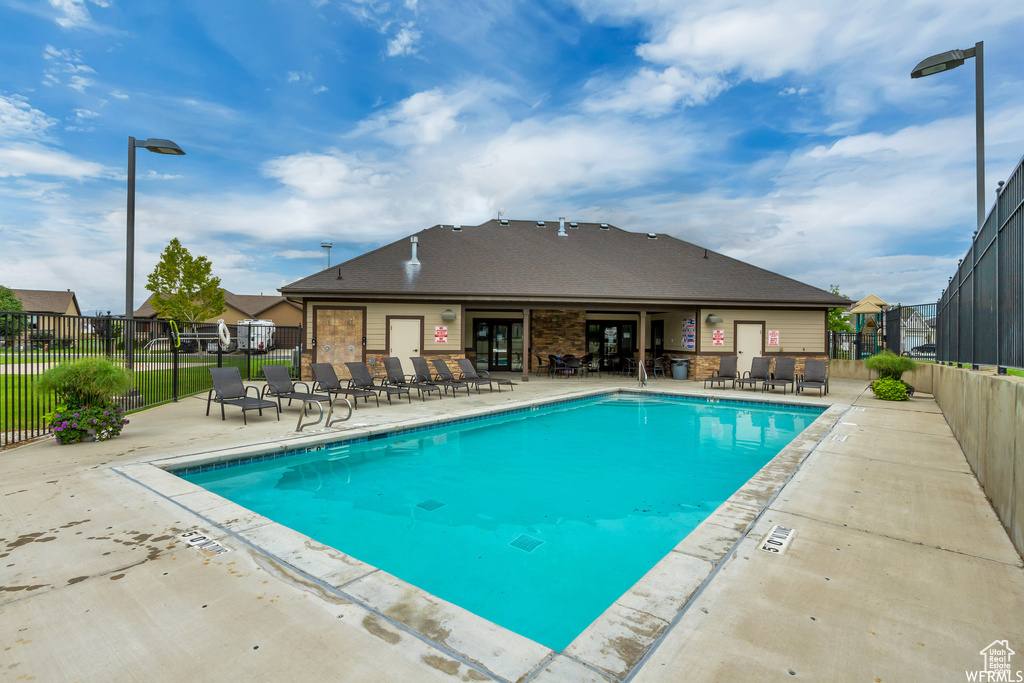 View of swimming pool with a patio area