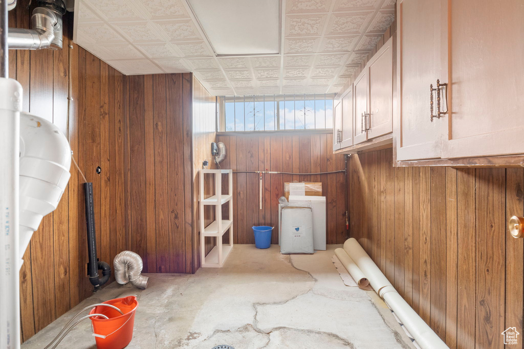 Bathroom with wooden walls and concrete floors