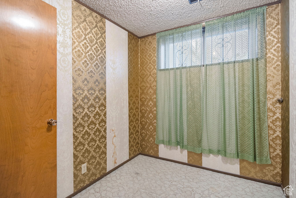 Bathroom featuring a textured ceiling