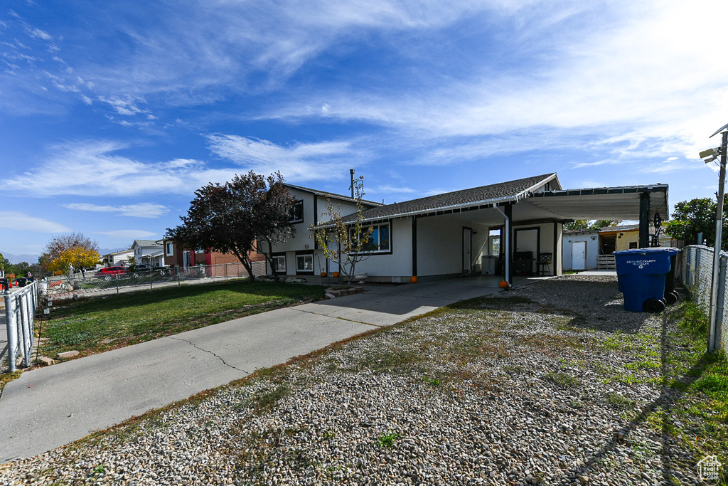 View of front of house with a carport