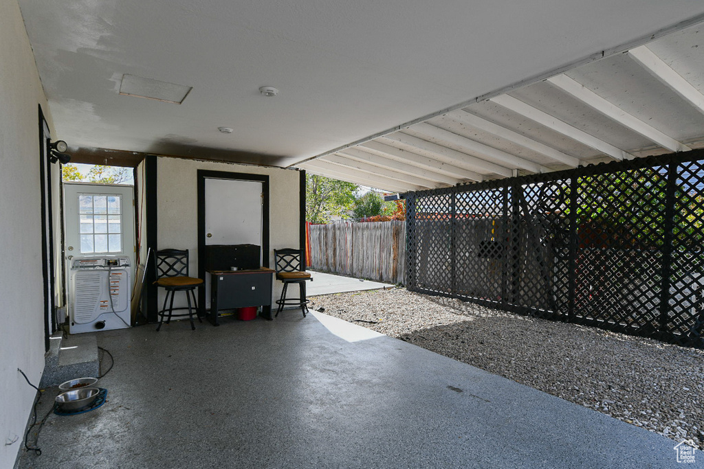 View of patio with a carport