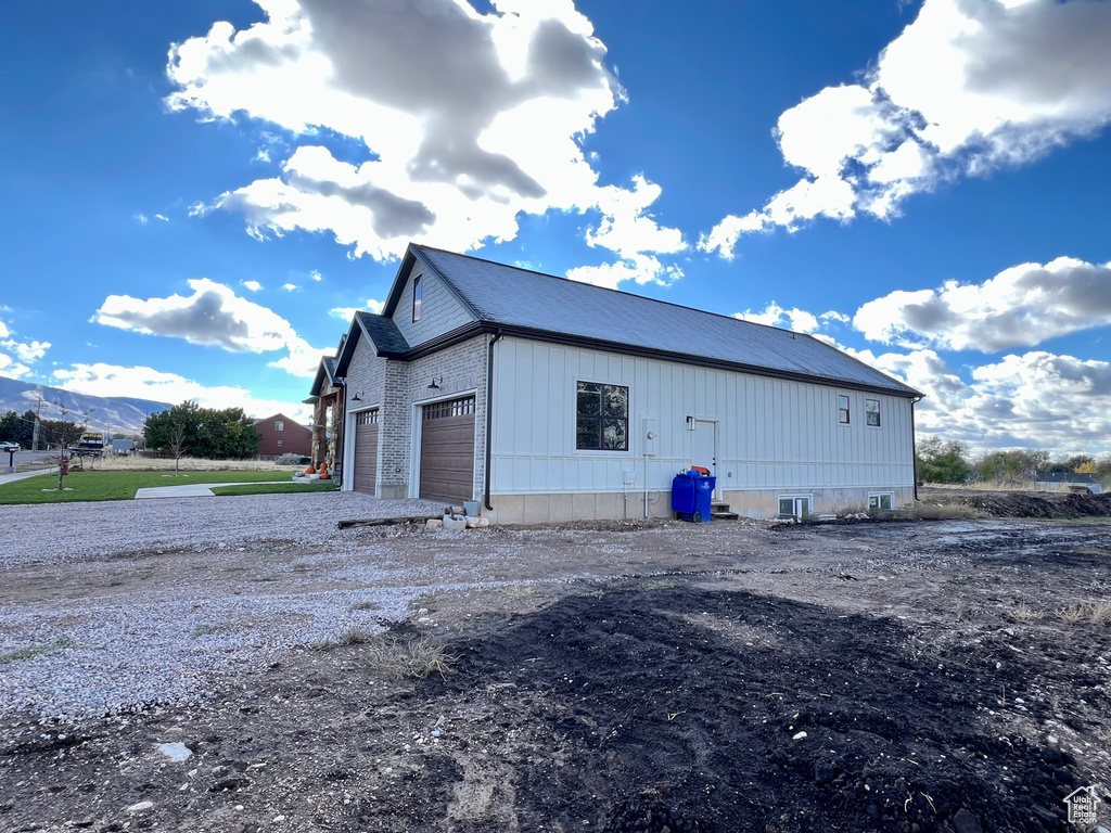 View of outbuilding featuring a mountain view