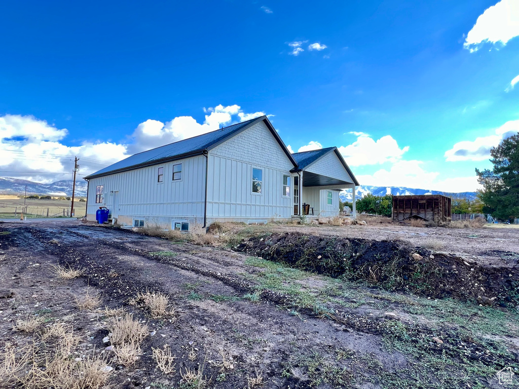 View of property exterior with a mountain view