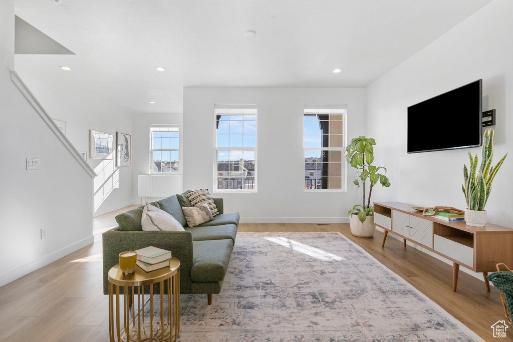 Living room with light hardwood / wood-style flooring