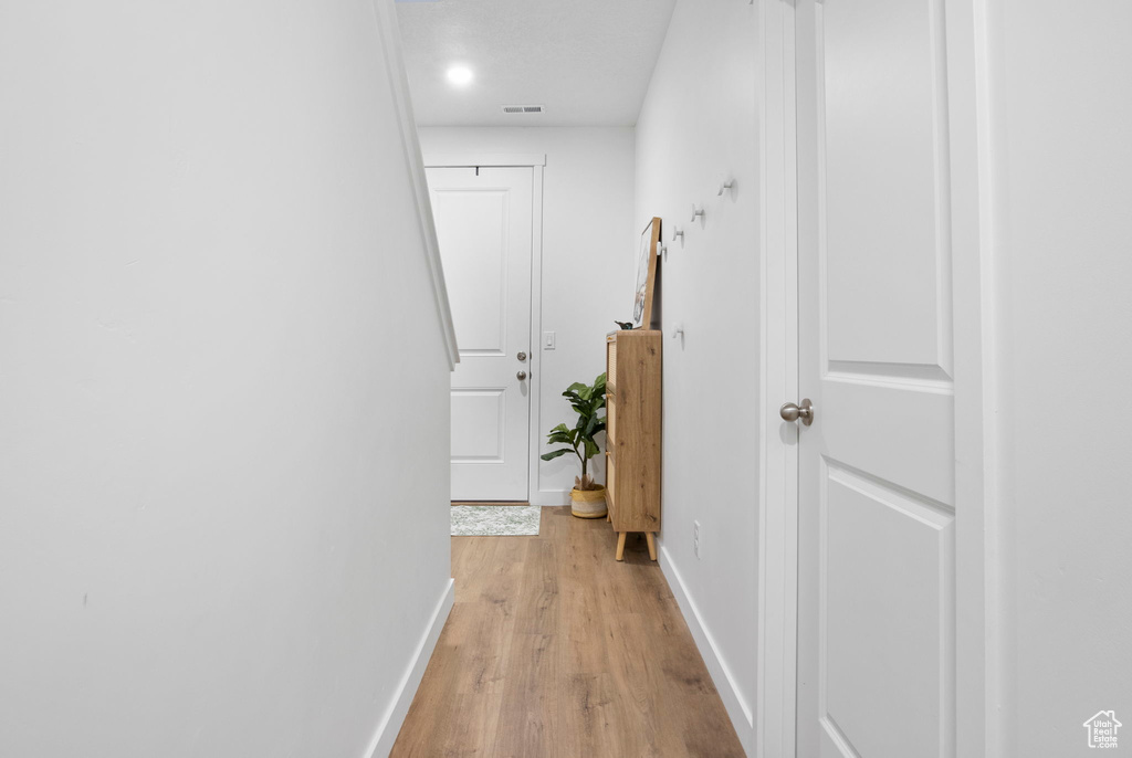 Hall featuring light hardwood / wood-style floors