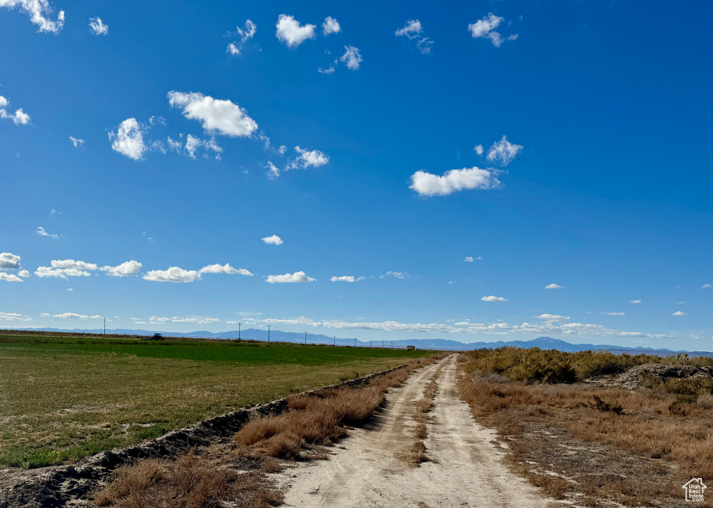 View of road with a rural view and a mountain view