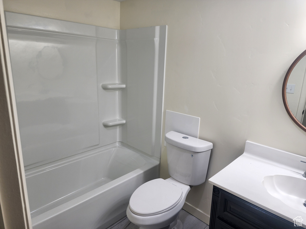 Full bathroom with vanity, toilet, and shower / bathing tub combination