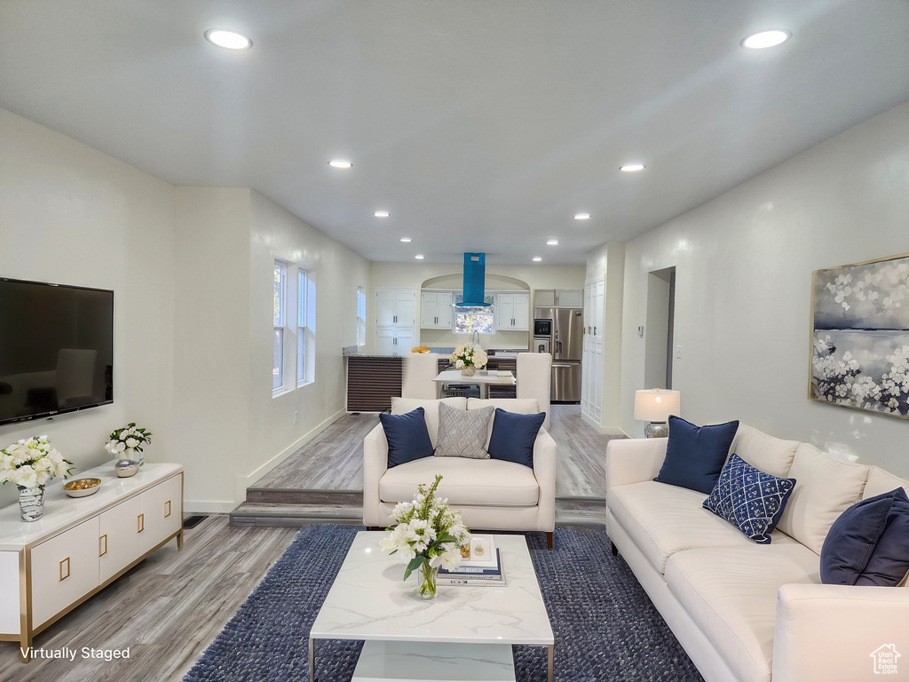 Living room with wood-type flooring