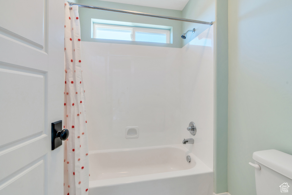 Bathroom with shower / bath combo and toilet