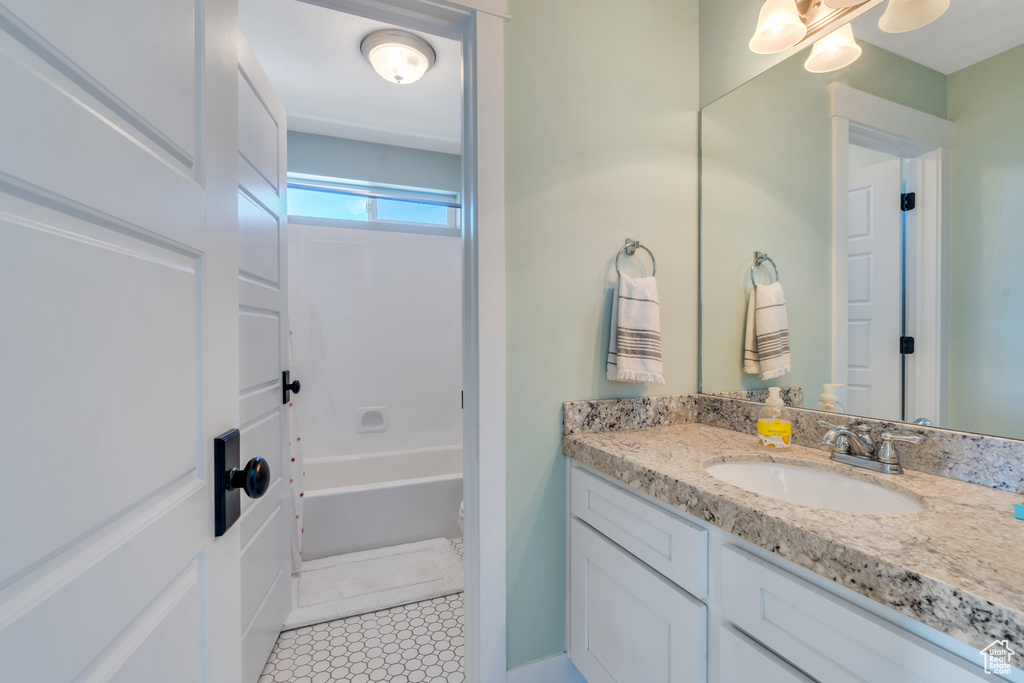 Bathroom featuring vanity and tile patterned floors