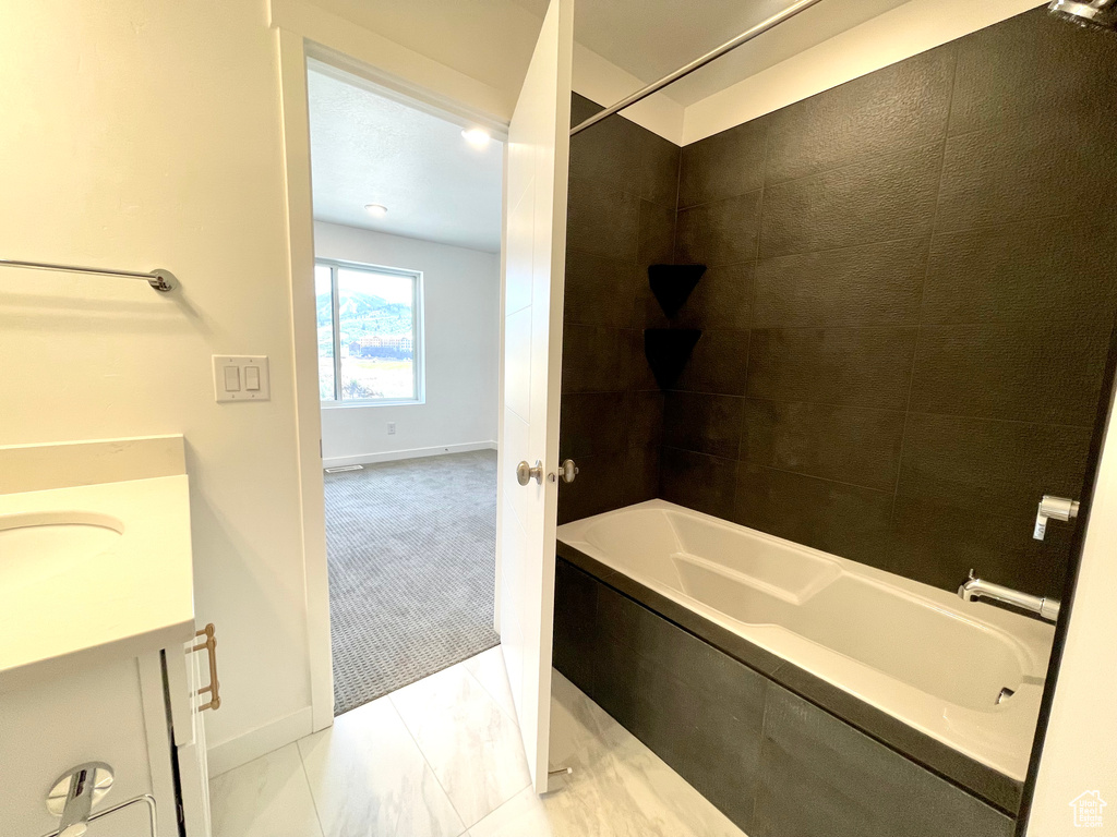 Full bathroom with vanity and bathing tub / shower combination