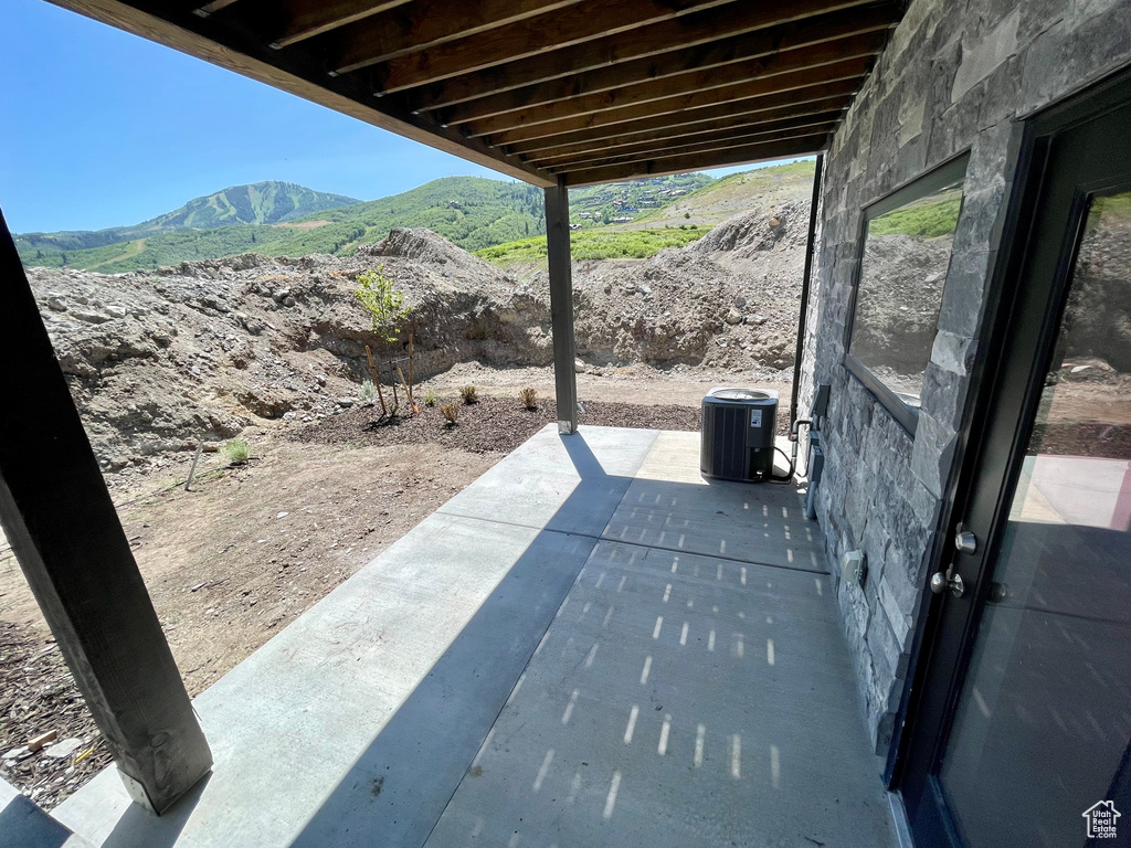 View of patio with a mountain view
