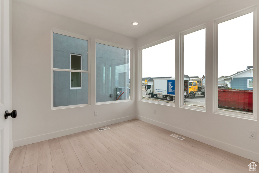 Unfurnished sunroom with visible vents