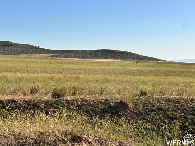 Property view of mountains featuring a rural view