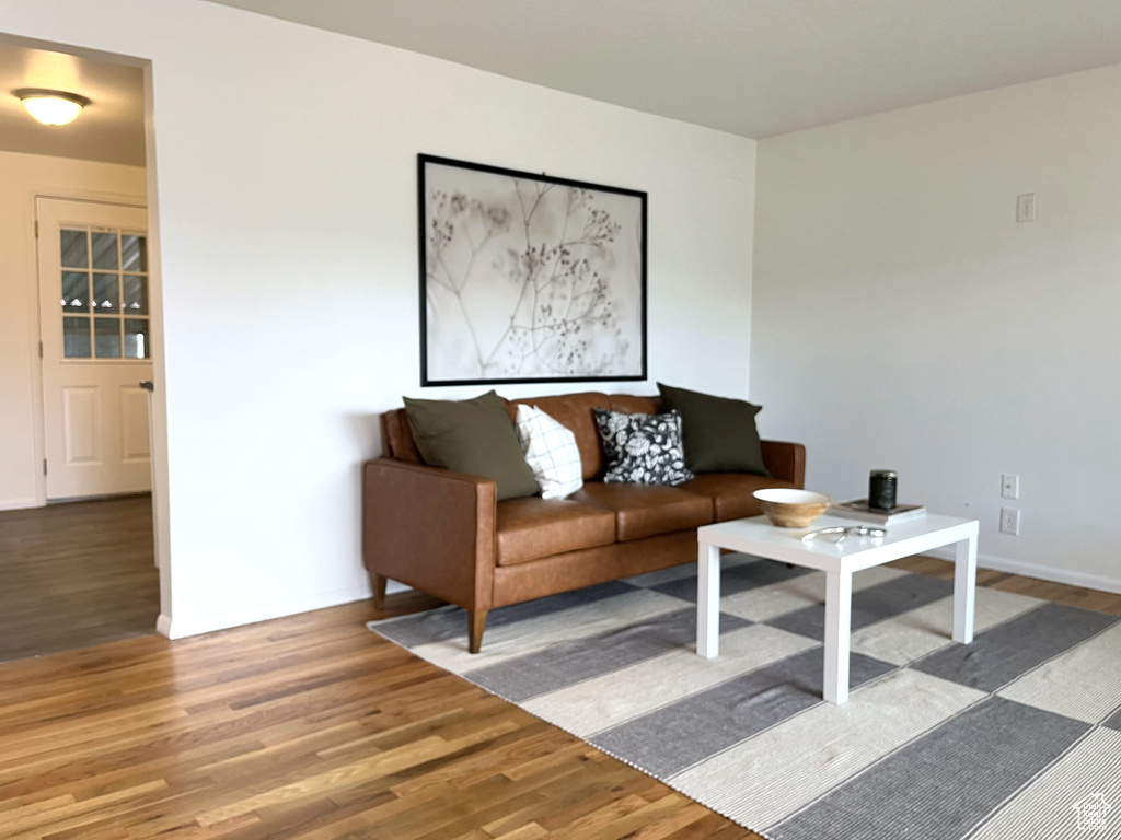 Living room with baseboards and wood finished floors