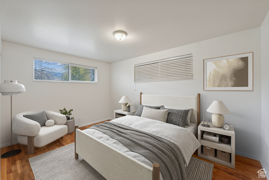 Bedroom with hardwood / wood-style floors