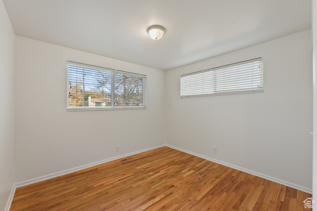 Spare room featuring hardwood / wood-style floors
